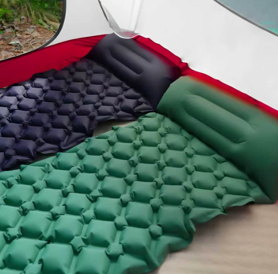 Two inflatable mats laid out side by side inside a tent