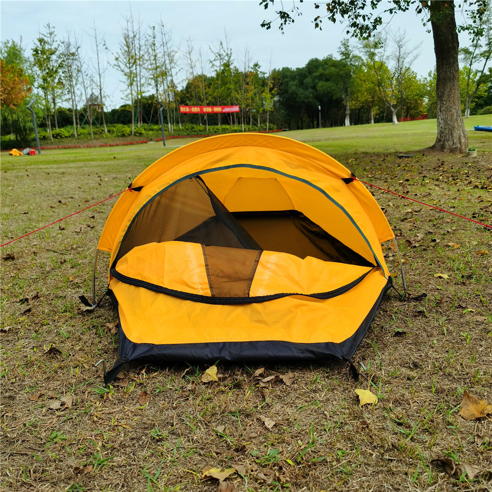 Yellow bivvy tent with the door open, mesh inner visible
