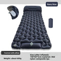 Inflatable sleeping mat in navy, showing the integrated pillow and foot pump