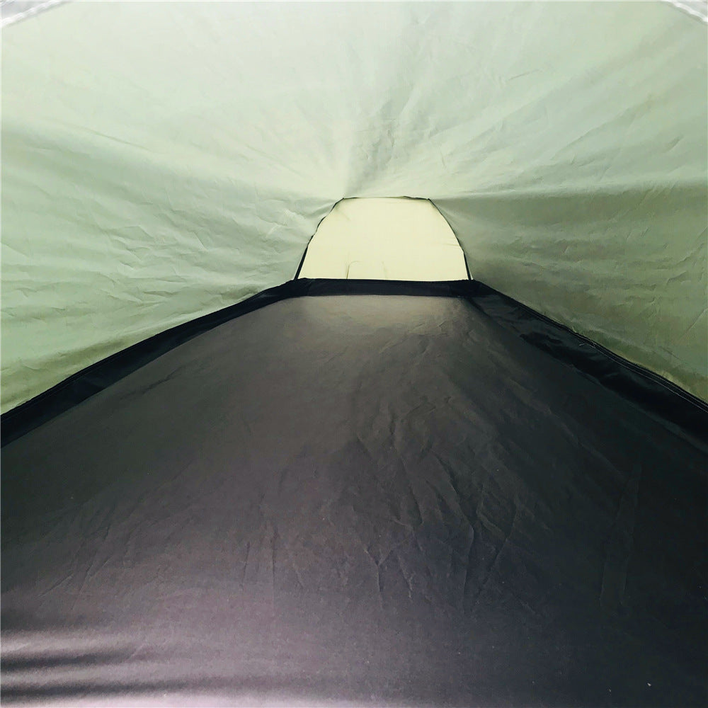 Inside the tent looking down its length, showing the groundsheet and far vent