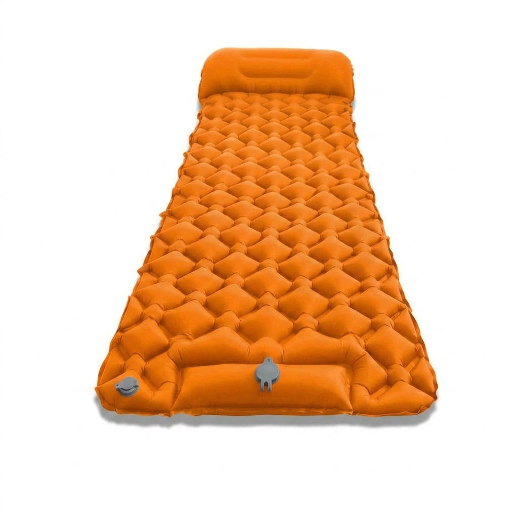 The 6 cm Orange mat inflated, seen from above, with its integrated head rest and the foot pump panel and valves at the foot end.