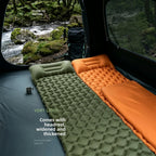Olive and orange inflatable mats laid side by side inside a tent, looking out on a mossy river. Caption: very light, comes with headrest, widened and thickened.
